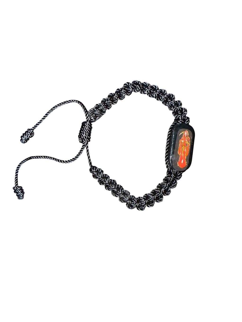 Santa Muerte Protection Bracelets Infused with Sacred Energy on Wooden Setting
