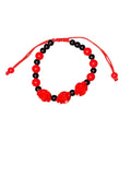 Santa Muerte Protection Bracelets Infused with Sacred Energy on Wooden Setting